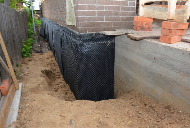 SJ Waterproofing Pros technician performing targeted Waterproofing assessment in Point Pleasant Beach, NJ